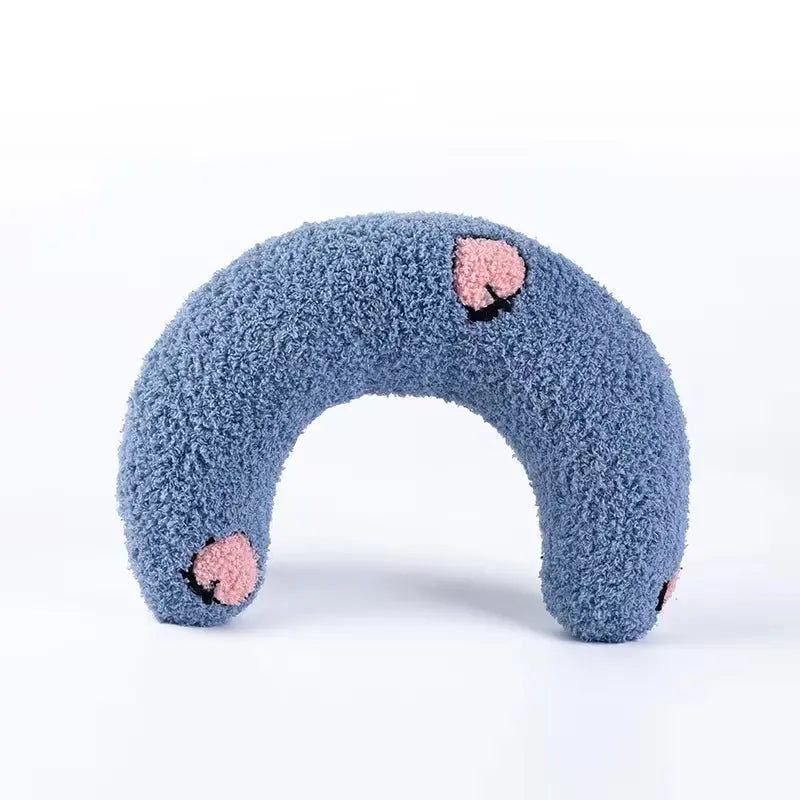 U-shaped pet pillow for cats and small dogs—ideal for neck support, deep sleep, and cozy headrest.